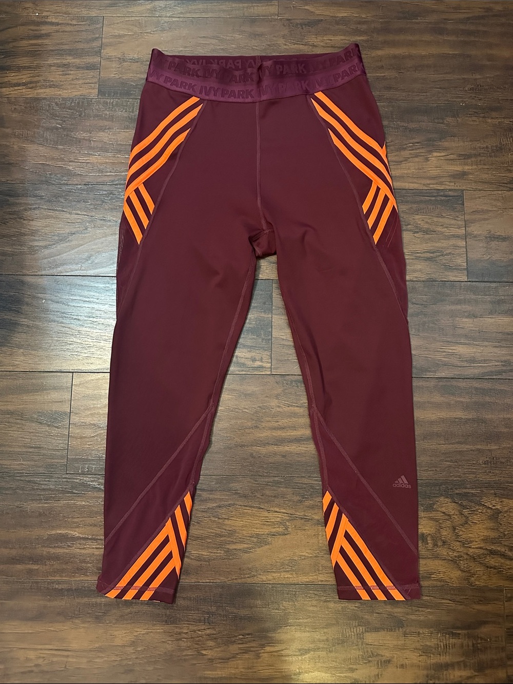 IVY PARK Maroon Capri Leggings with Bright Orange Stripe Accents